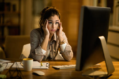 Person looking concerned on the screen of a computer.