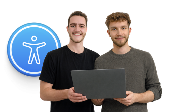 David Klunk and Ben Knaute standing next to each other and holding a laptop