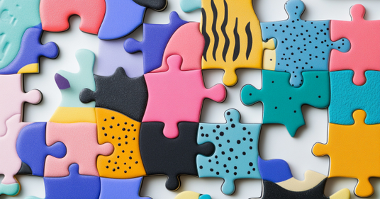 Colorful puzzle pieces with various patterns in the background.