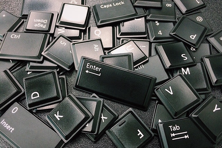 Computer keys lying around on the floor.