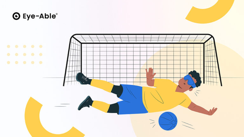 A man lying on the ground in front of a soccer goal and holding the ball