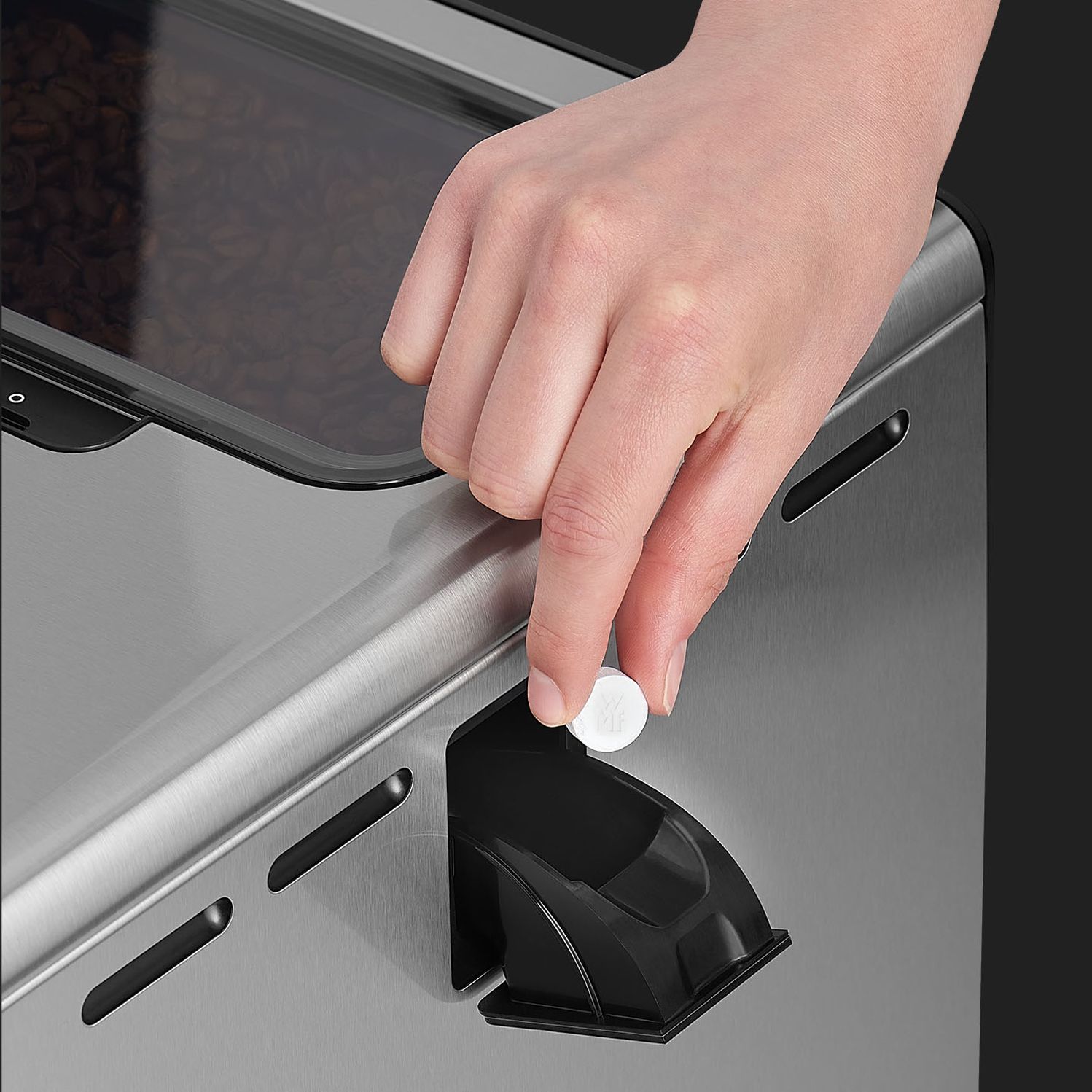 Cleaning tablet insert at WMF Perfection OFFICE