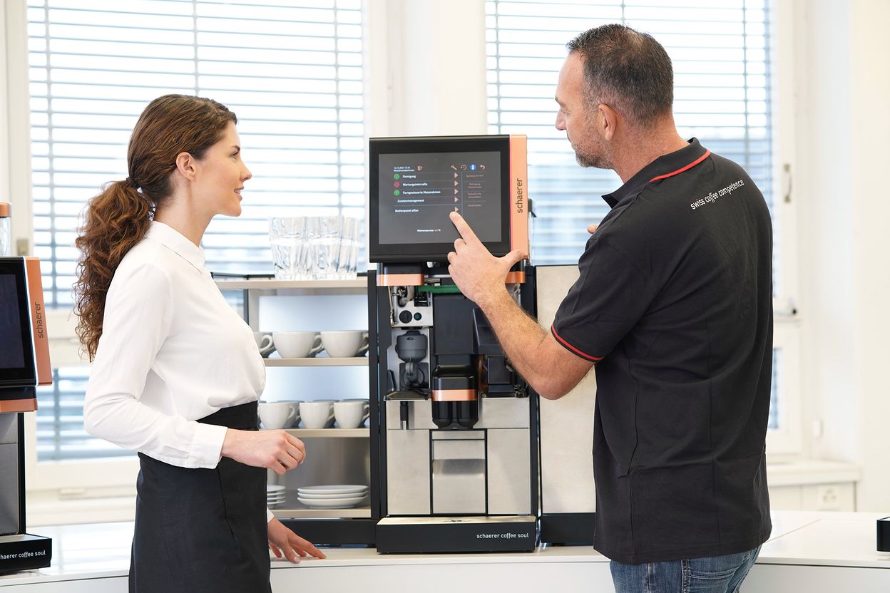 Schaerer service technician training an operator