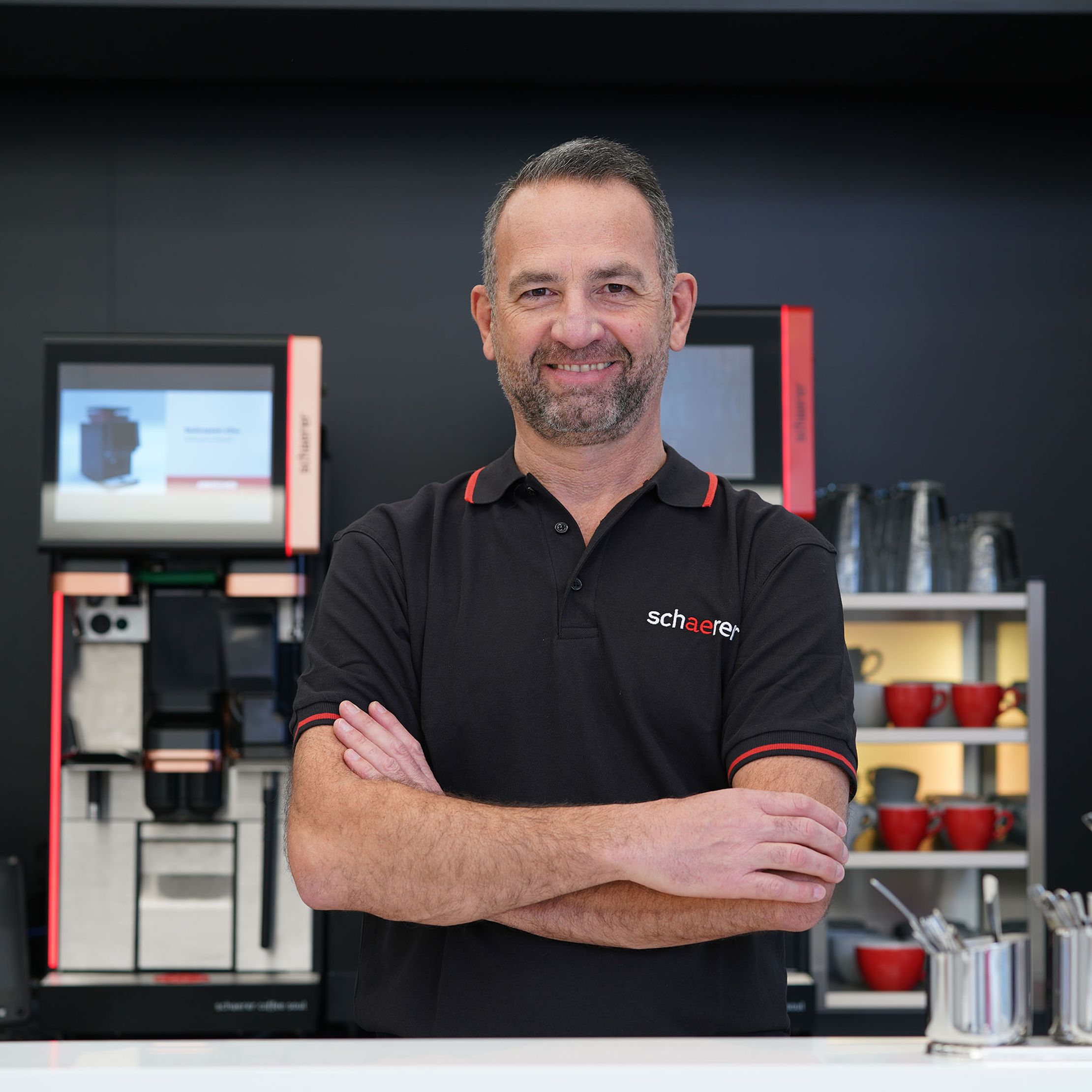 Schaerer service technican in front of a coffee machine
