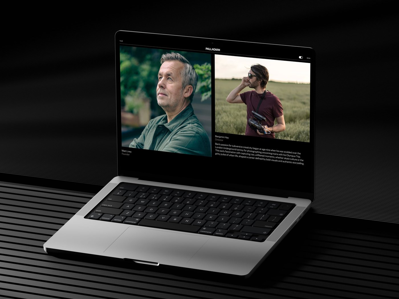 Laptop displaying two photos of people: one in an outdoor setting, the other holding a device in a field, on a dark ribbed surface.