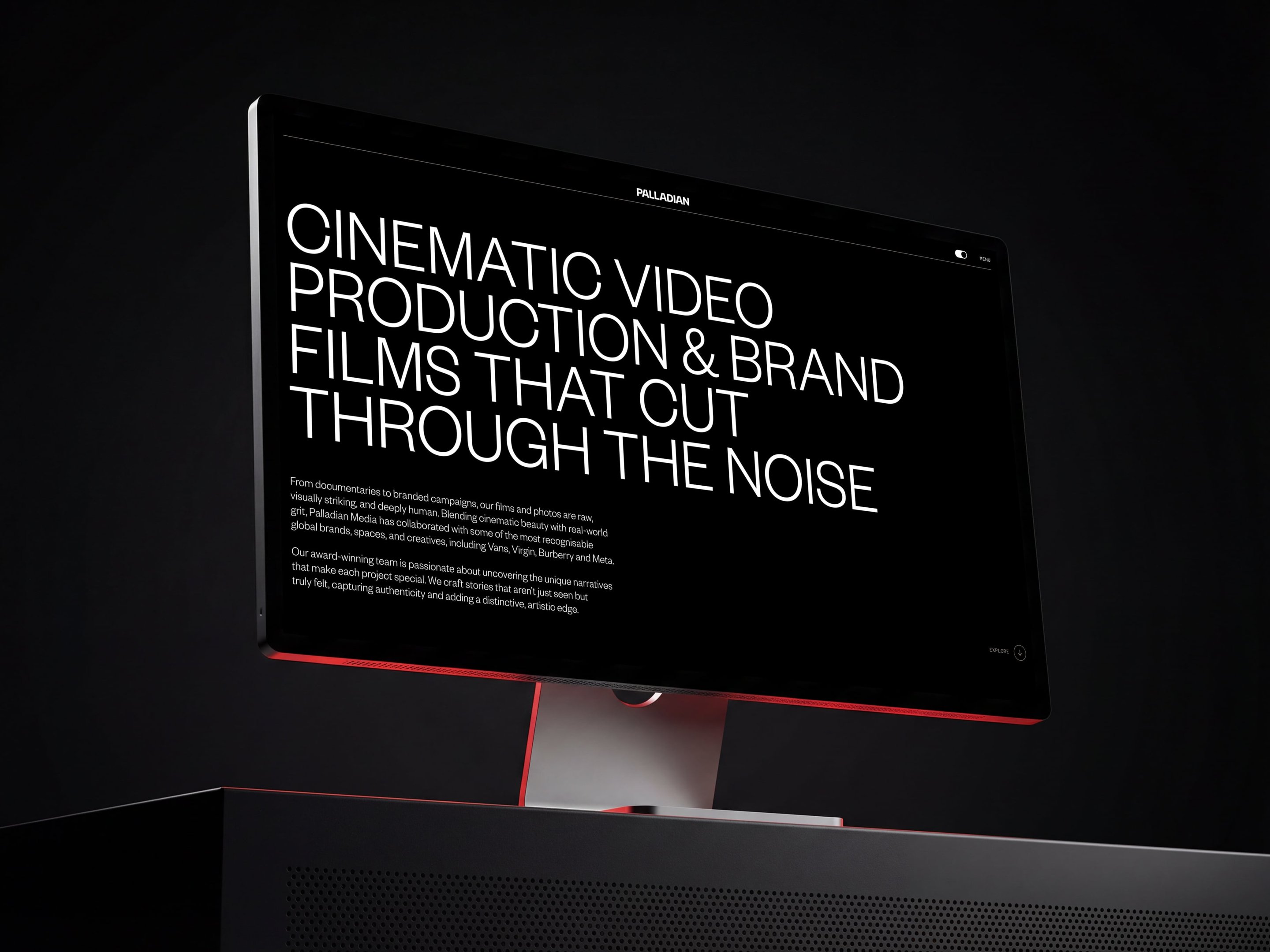 Computer screen displaying bold, white text: "Cinematic Video Production & Brand Films That Cut Through the Noise," on a dark background.
