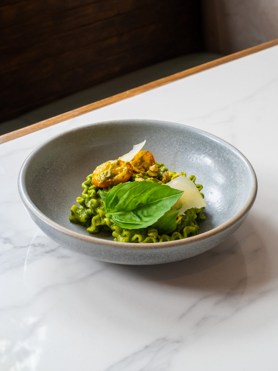 Mafaldine of pistachio, basil pesto, italian beans and stracciatella