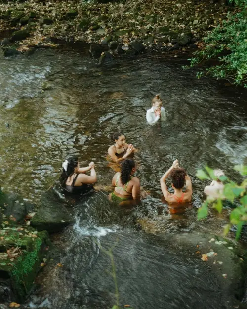 A large group staying at ARC Peaks taking advantage of the custom excursions available outside the accommodation. Pictured is cold water swimming.