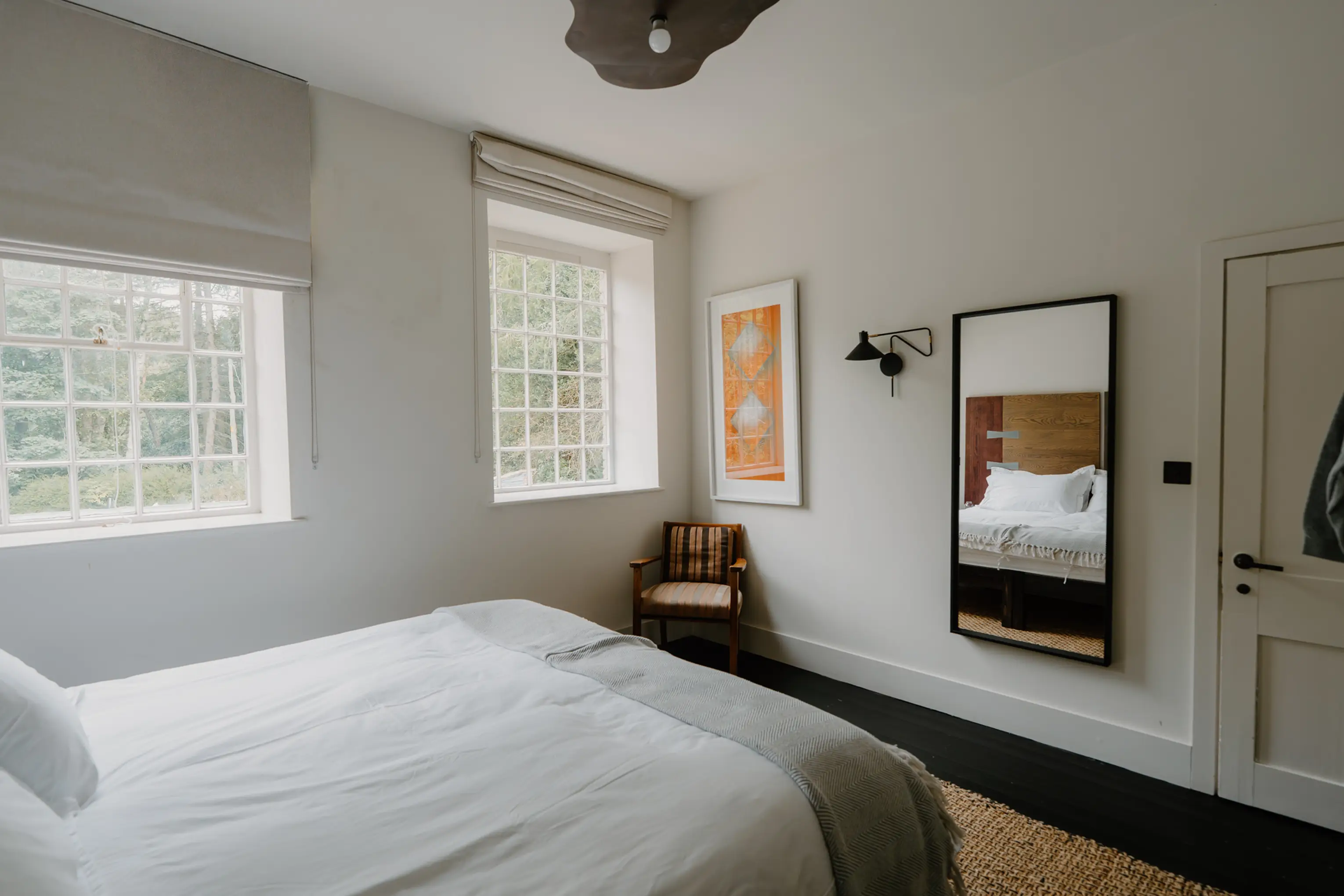 Superking bedroom at ARC Peaks with a mirror, artwork and windows