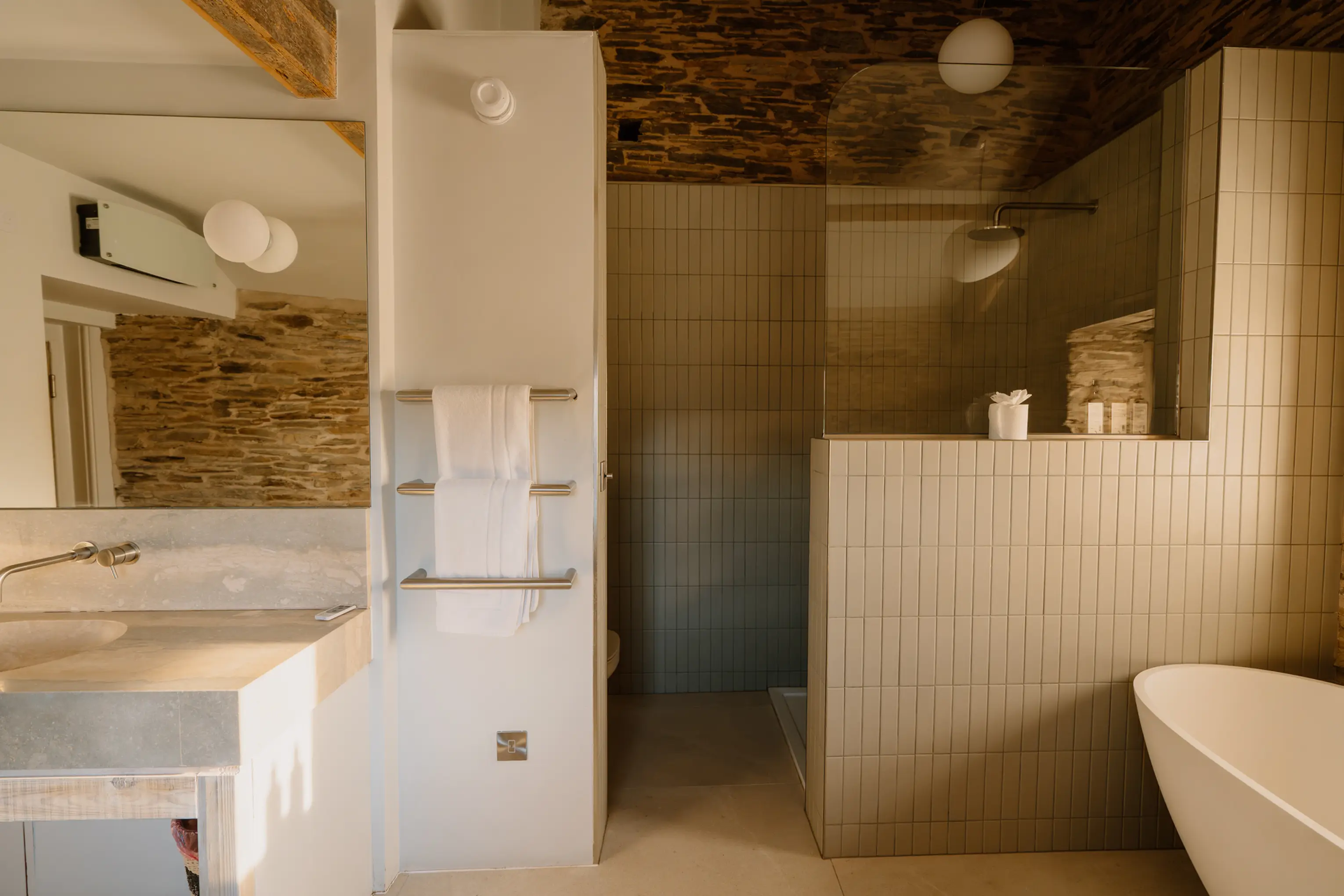 Ensuite bathroom at ARC Padstow with white tiling and a window
