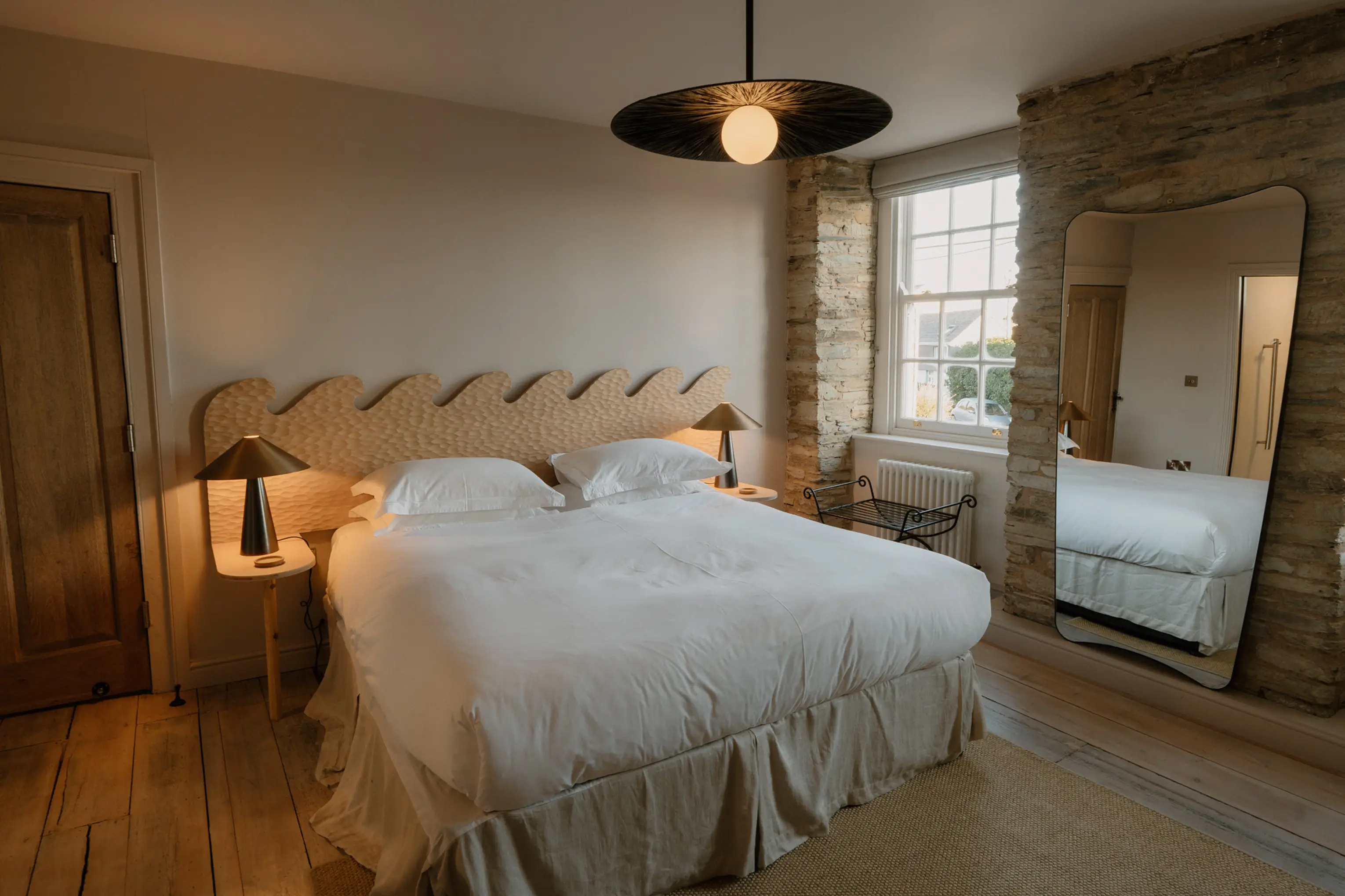 Superking bedroom at ARC Padstow with a beamed ceiling and pendant light