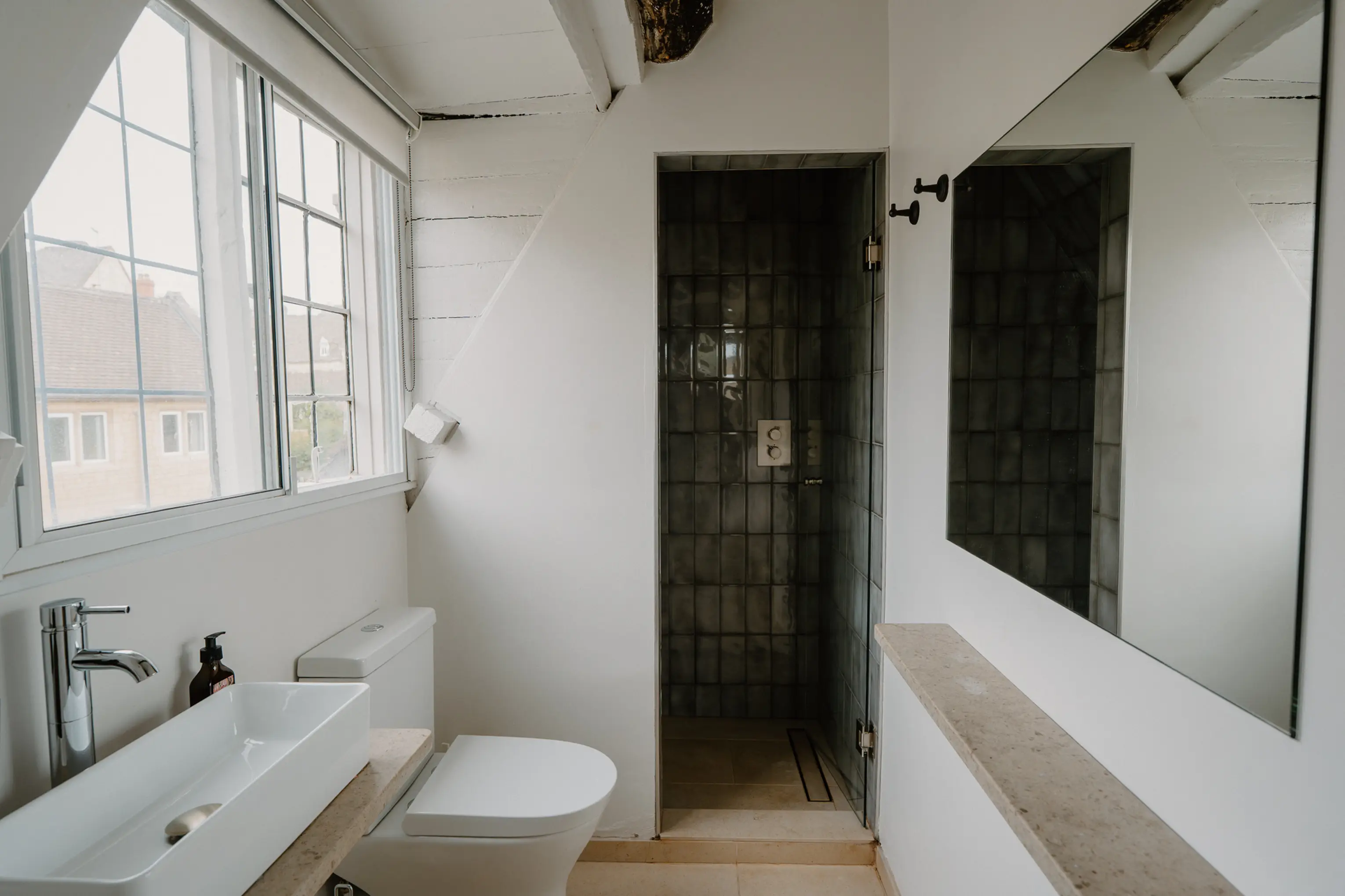 Ensuite at ARC Painswick with a walk-in shower and window