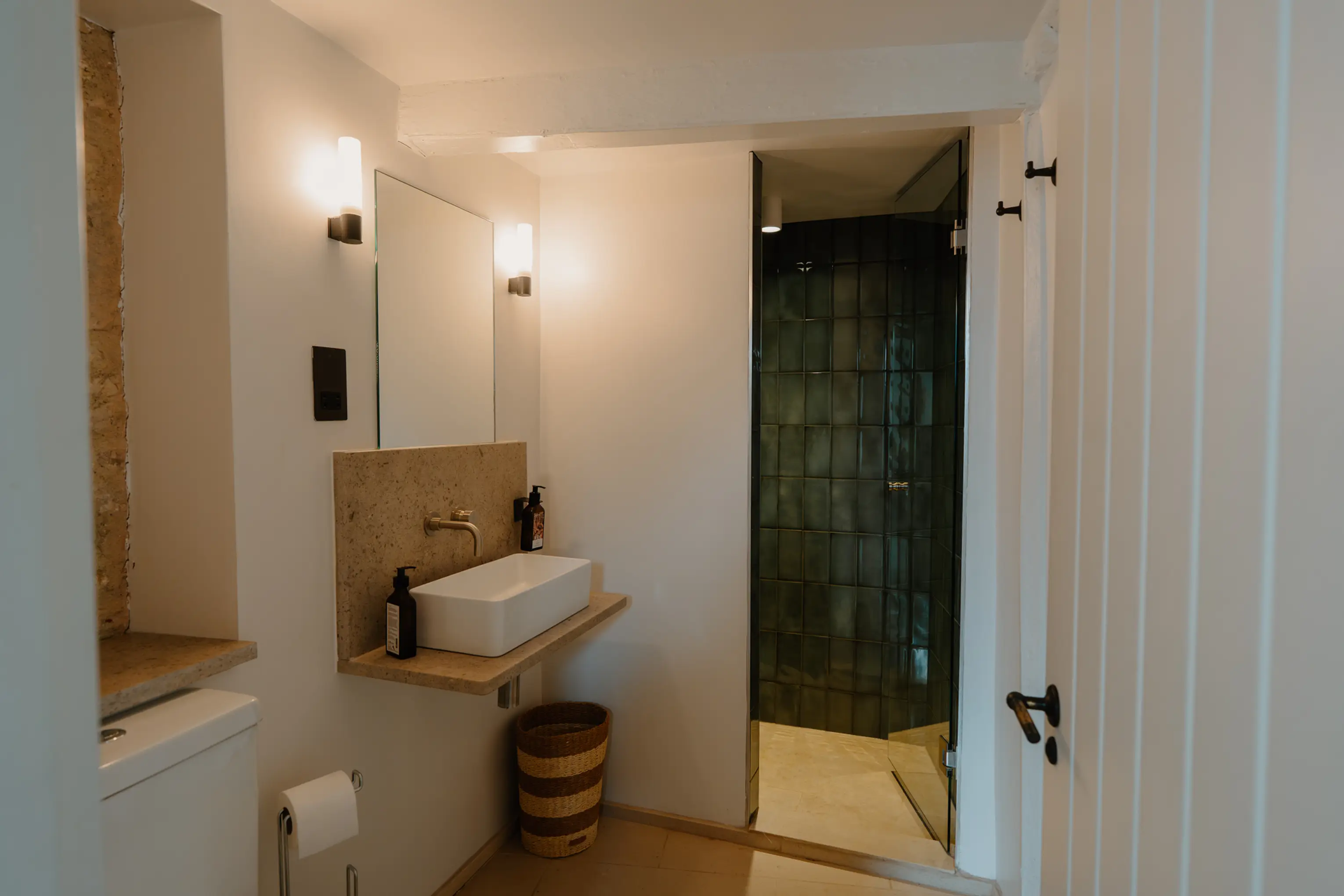Ensuite shower room at ARC Painswick with a pedestal basin and walk-in shower