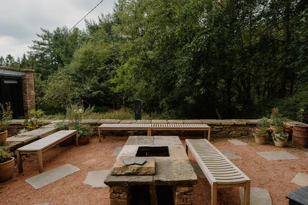 Outdoor fire pit at ARC Peaks with seating area