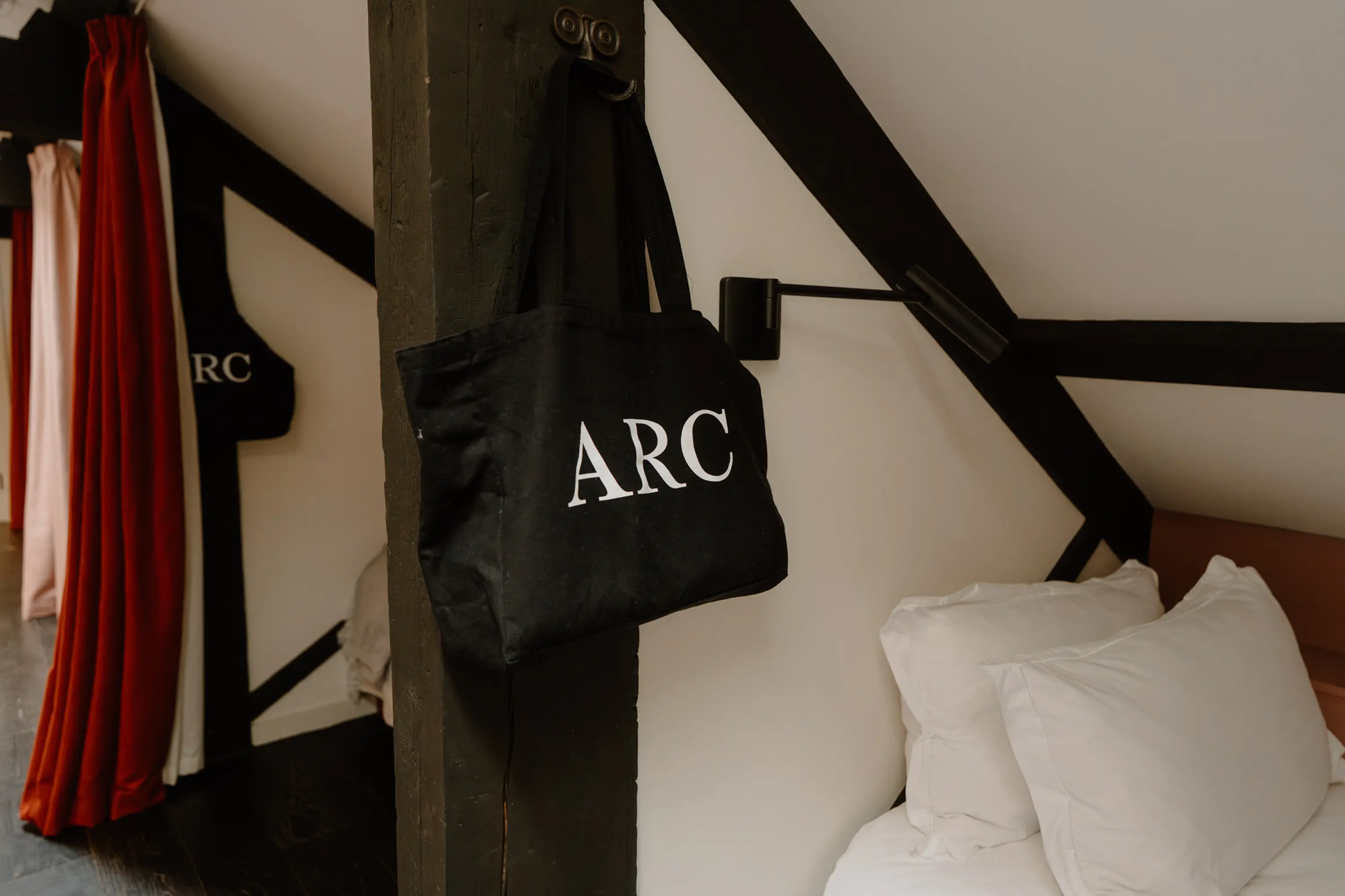 Attic bedroom detail at ARC Peaks with an ARC bag hanging beneath exposed beams