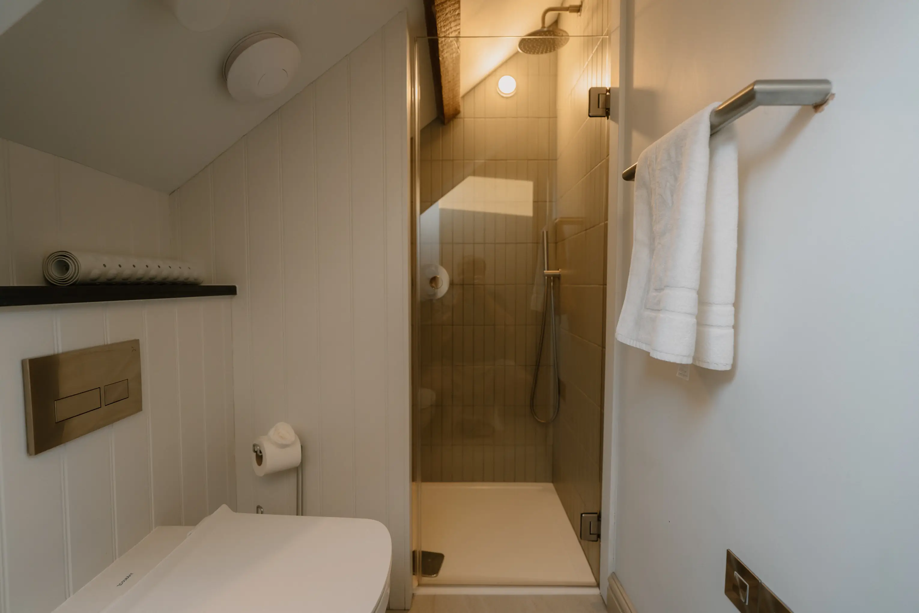 Ensuite shower room at ARC Padstow with a glass screen and towel rail