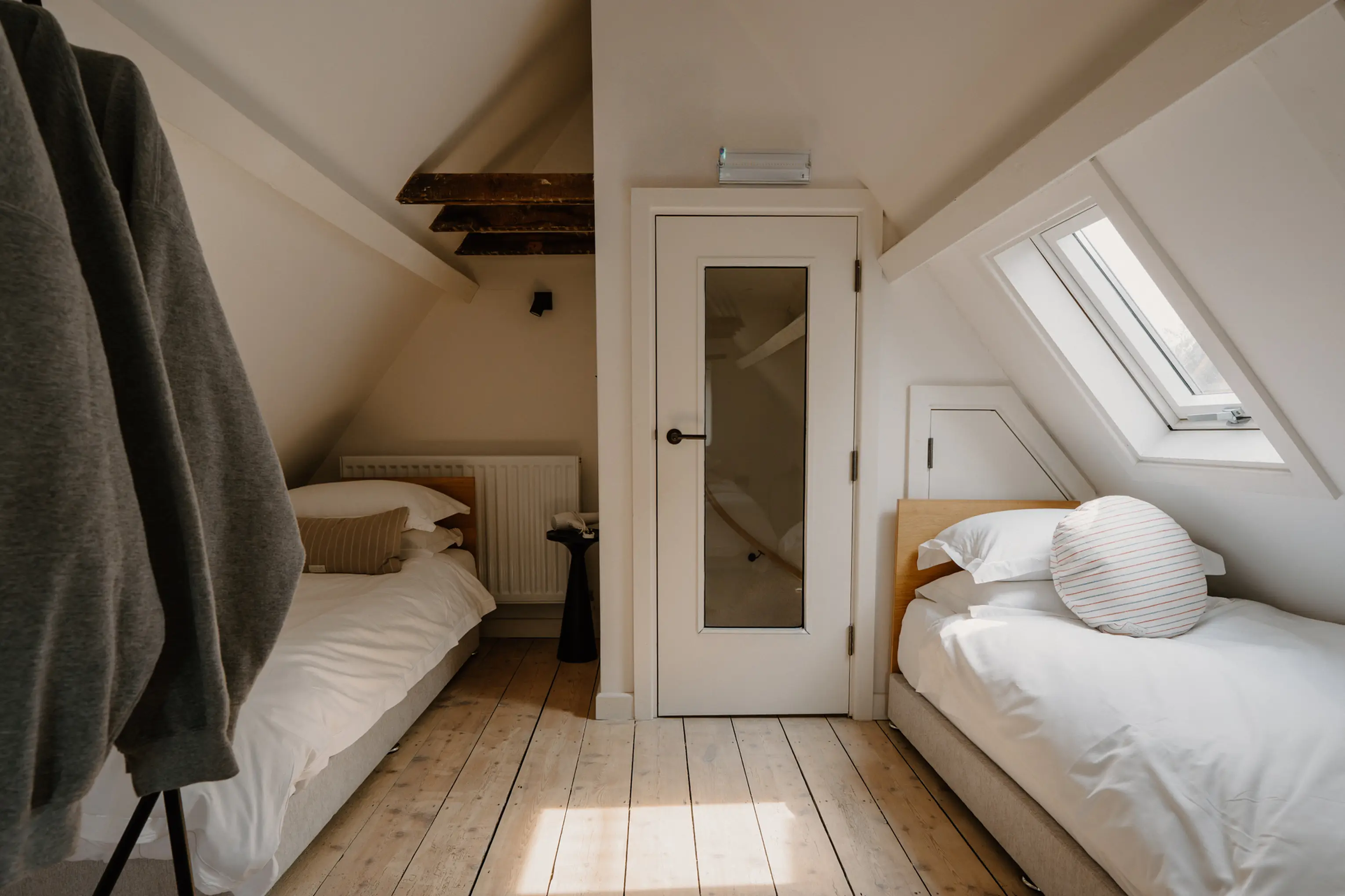 Attic single bedroom at ARC Painswick under the eaves beside an ensuite