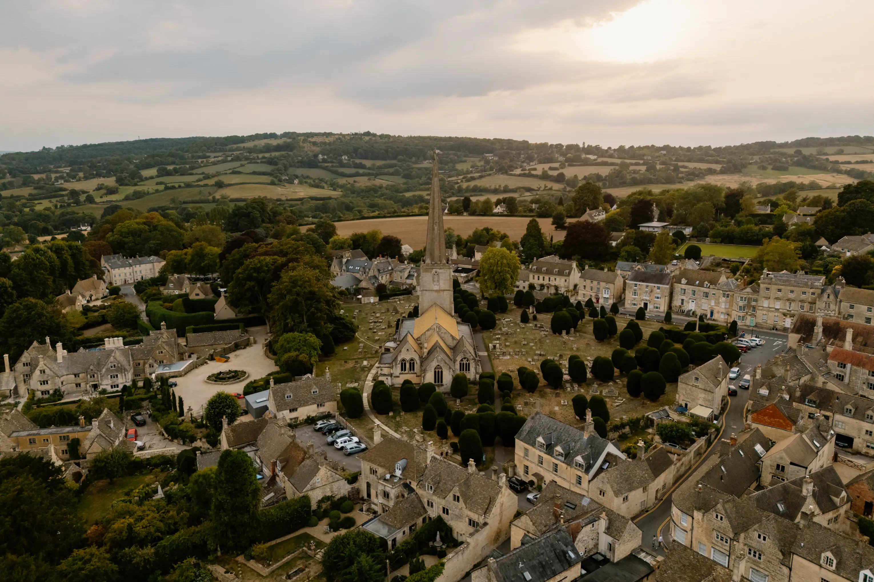 Aerial view over Painswick and the surrounding Cotswold countryside at dusk