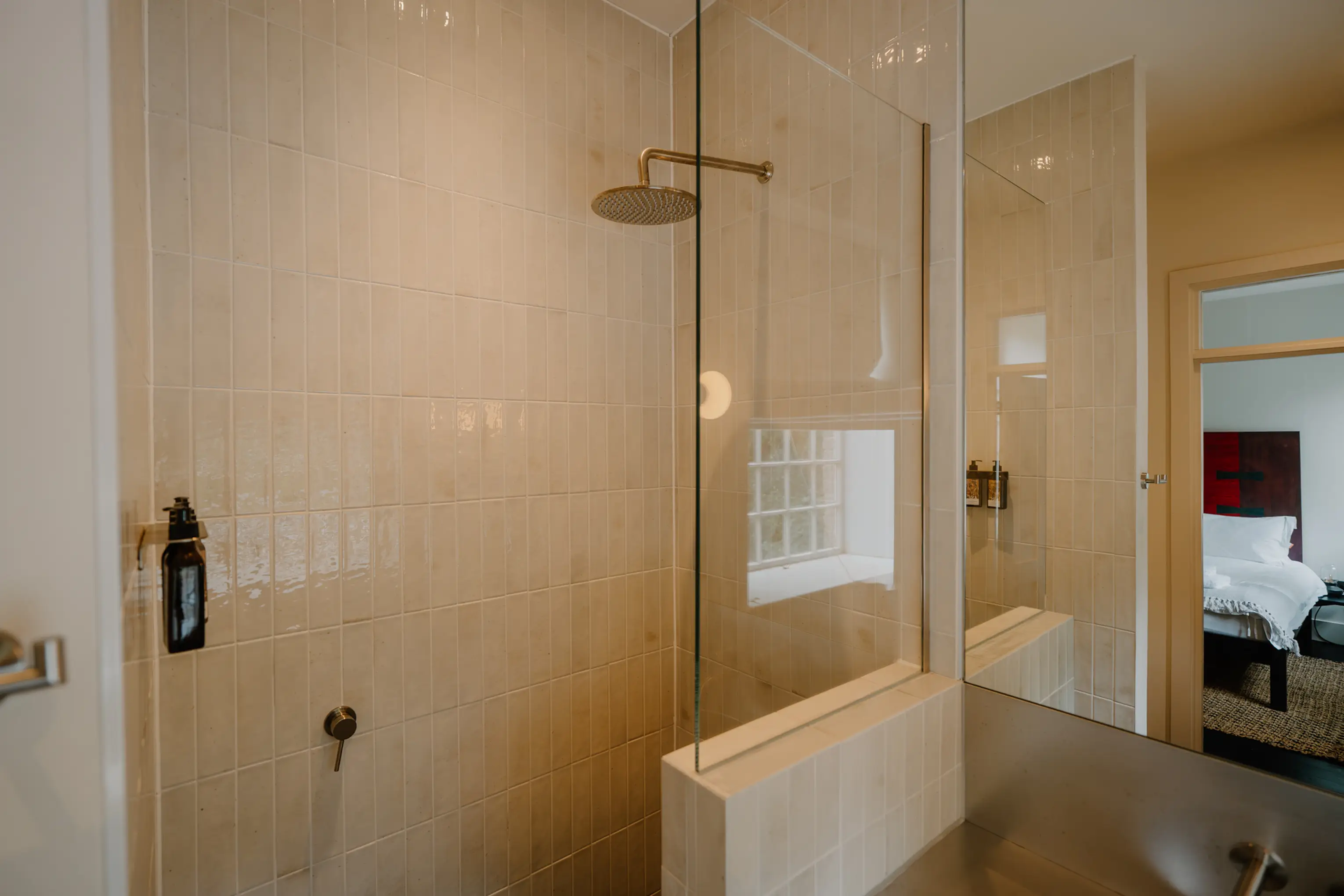 Tiled walk-in shower with a glass screen at ARC Peaks