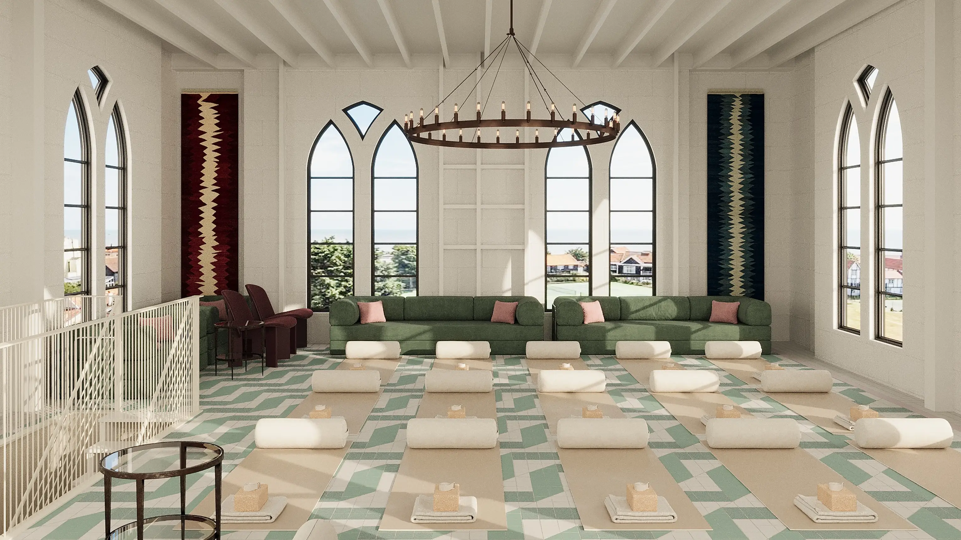 Yoga studio in the top-floor room at ARC Thorpeness, with mats laid out beneath arched windows