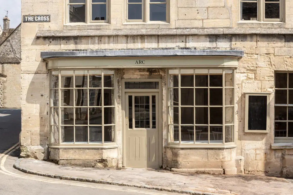 Looking in through the historic renovated and restored Cotswold building to the large communal dining area available to large groups staying at ARC Painswick.
