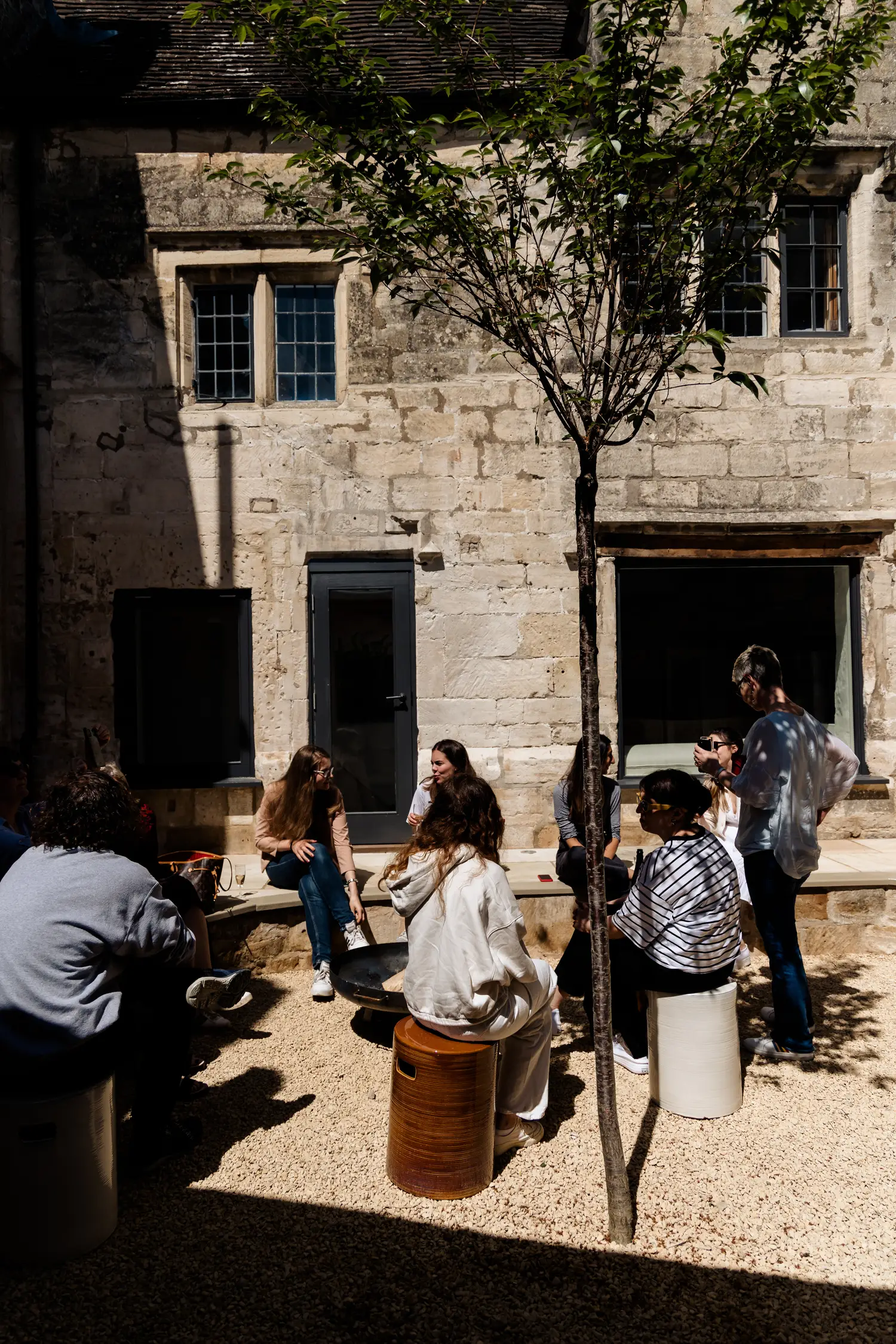 A group staying at ARC Painswick taking advantage of the amenities available and designed for large groups and families. Pictured is the central courtyard, available for entertaining and dining.