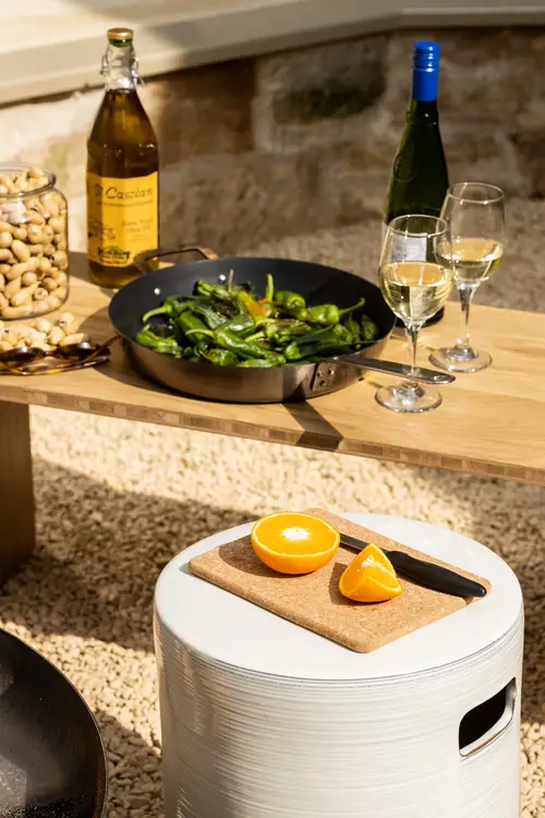 A group staying at ARC Painswick taking advantage of the catered and private dining available inside the accommodation. Pictured is a custom barbecue alfresco dinner with wine pairings, all served outdoors.