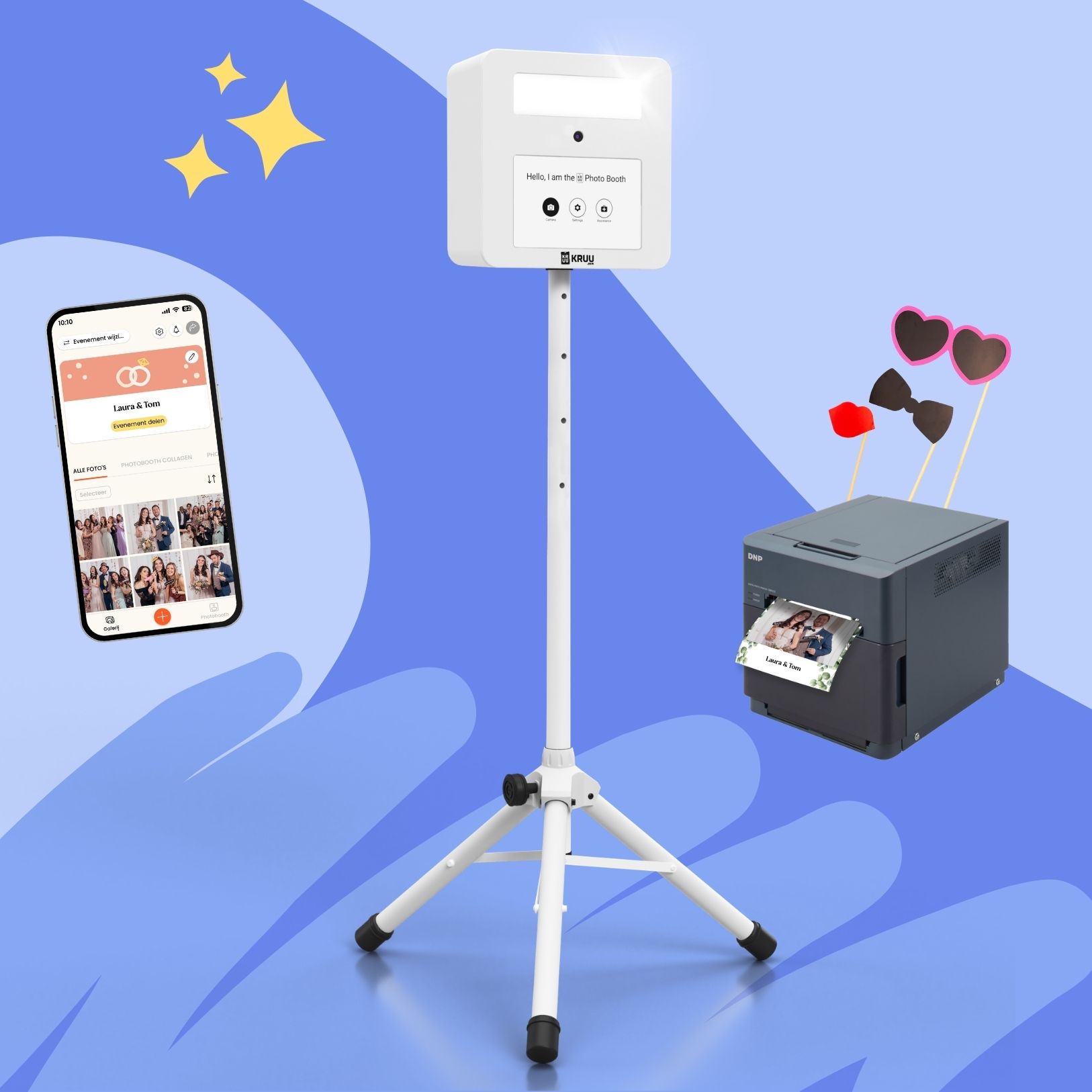 A product layout on a blue background featuring a white KRUU photo booth on a tripod stand in the center. To the left, there is a smartphone displaying a digital event gallery within the KRUU App. To the right, a dark grey DNP printer is shown with a freshly printed photo of a couple. Above the printer, three photo props like heart-shaped glasses, a bow tie and a kissing mouth are assembled.