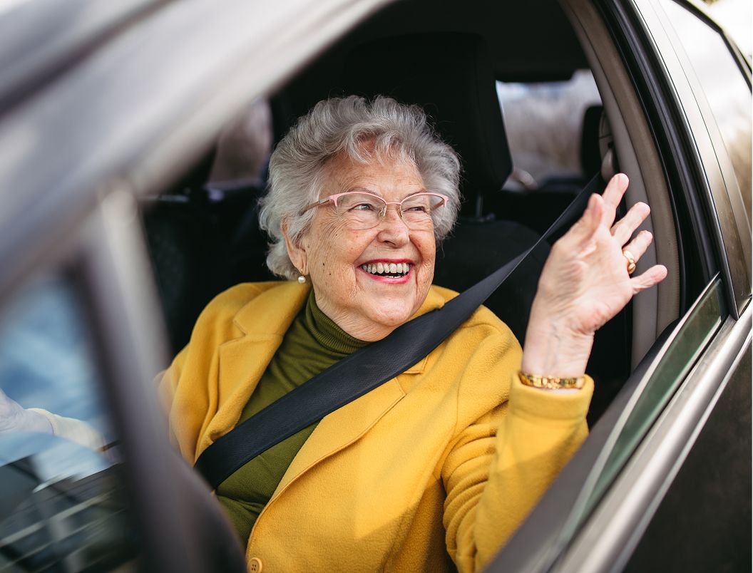 person in car in car park