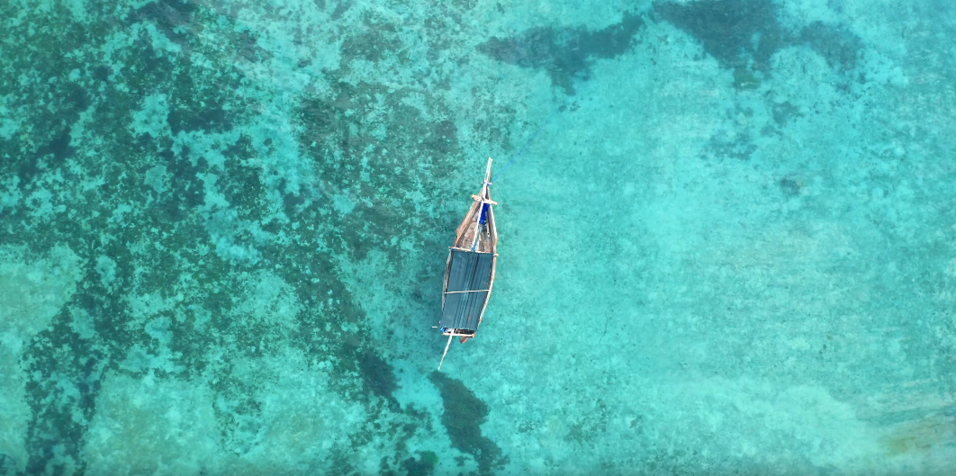 image of a boat in crystal blue waters