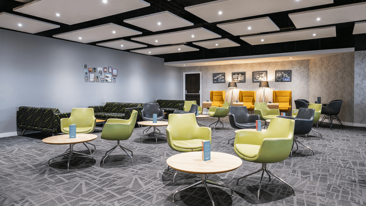 Image depicting the main seating area at Escape Lounge. There is a selection of seating options, for dining or relaxation.