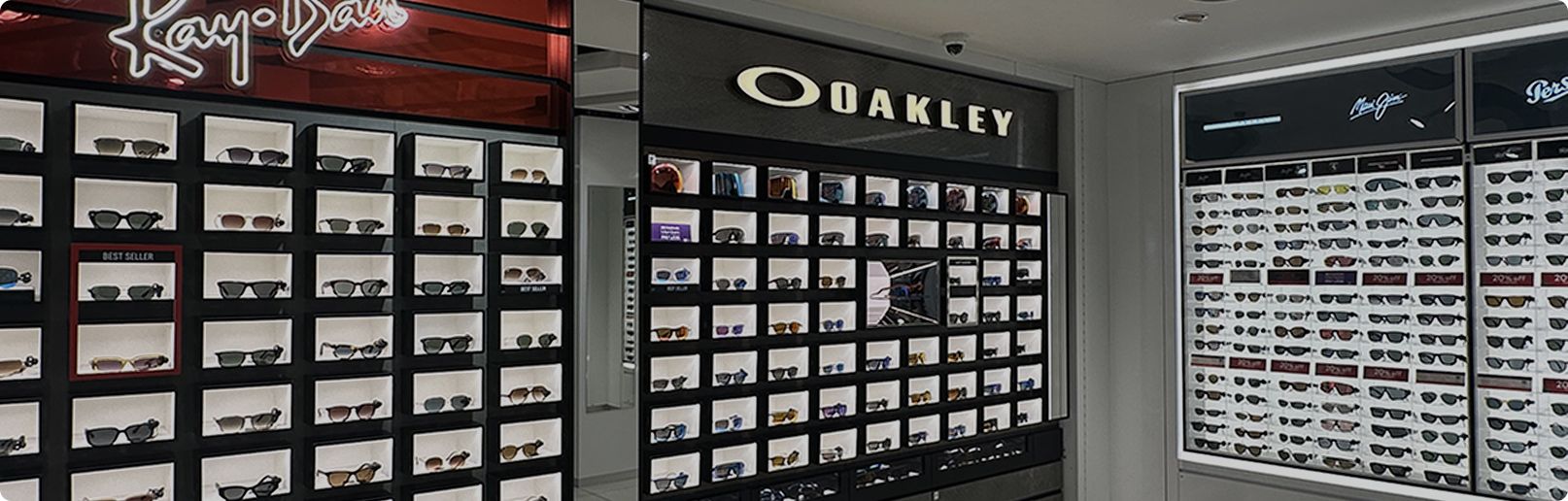 Sunglasses for sale on wall in shop