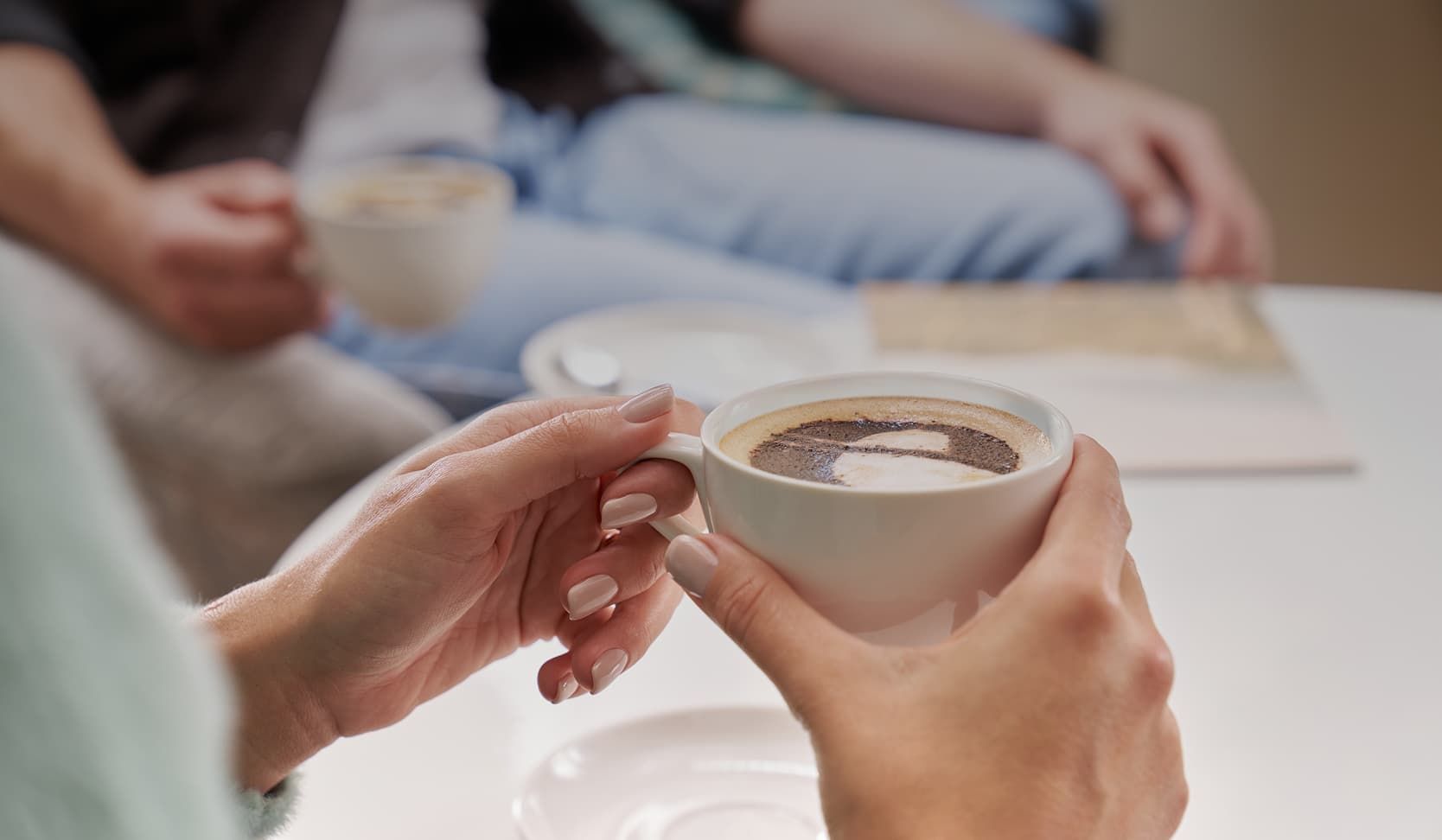 Woman holding hot drink