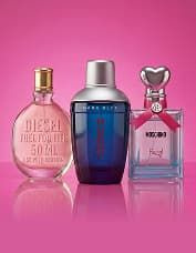 Three perfume bottles on a pink background: a round pink bottle, a blue cylindrical bottle, and a square bottle with a heart-shaped cap.