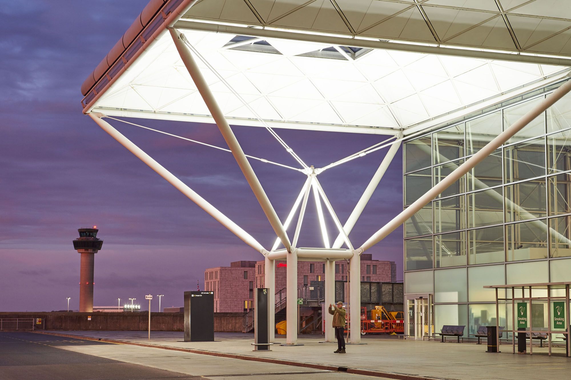 London Stansted Airport entrance with purple sky in background