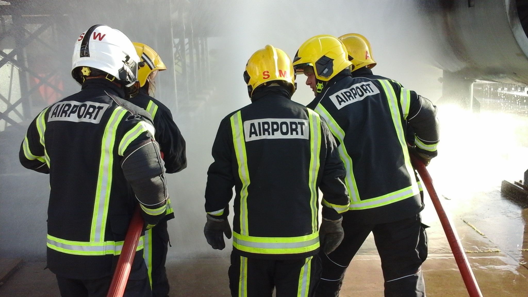 Group of firefighters looking at smoke