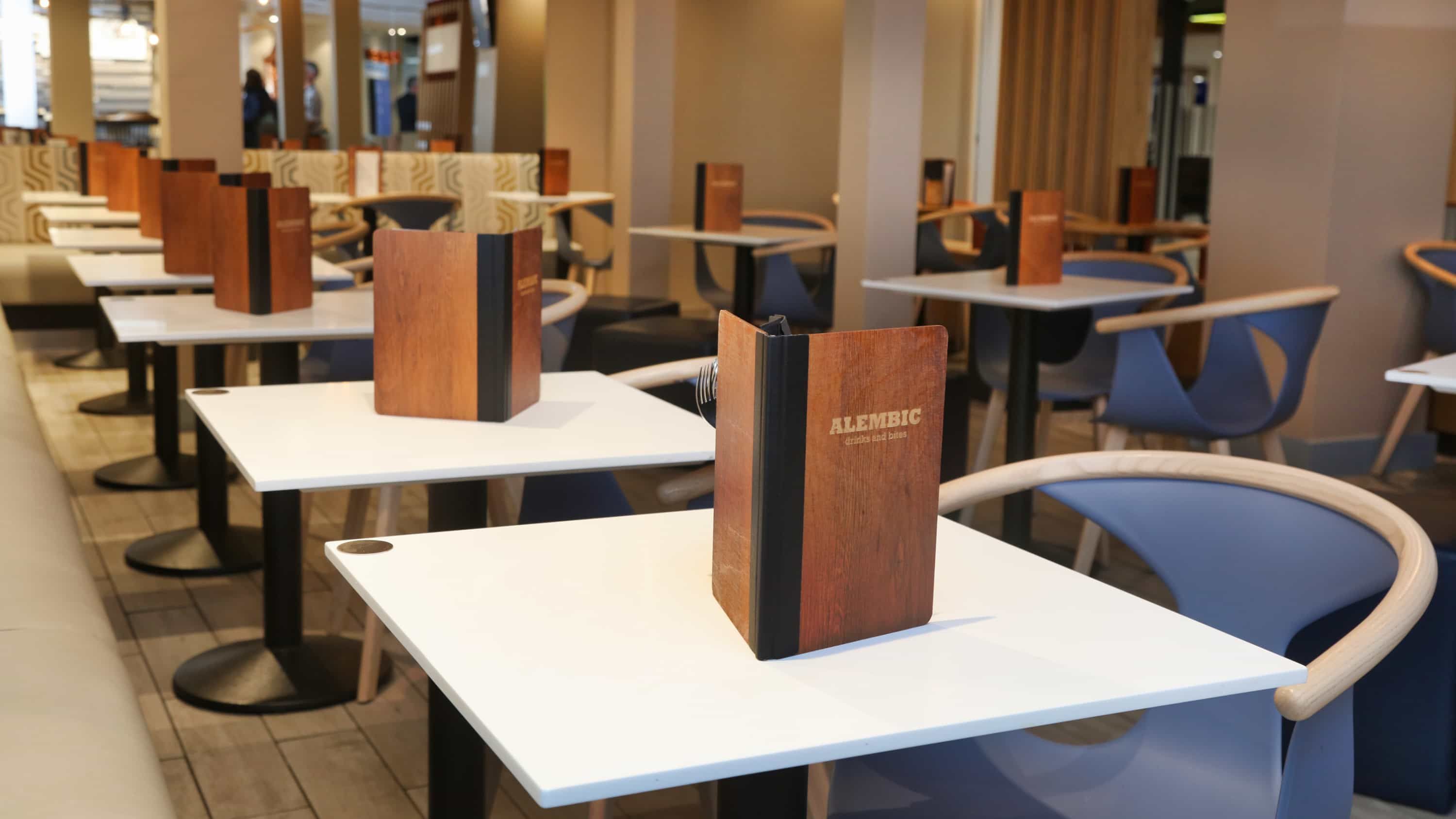 Tables with menus on top at Alembic restaurant