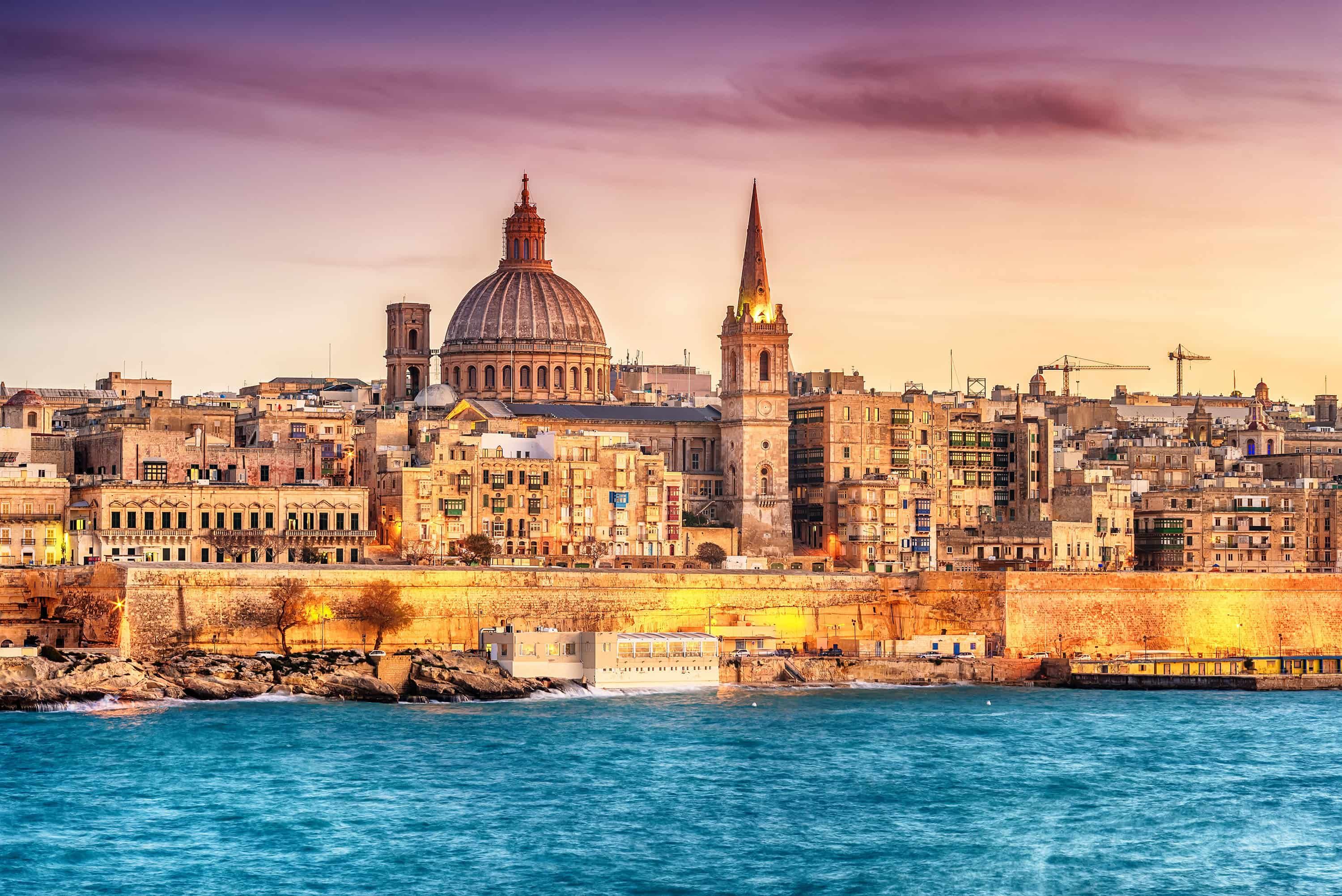 Sea view of Malta with historic buildings in background