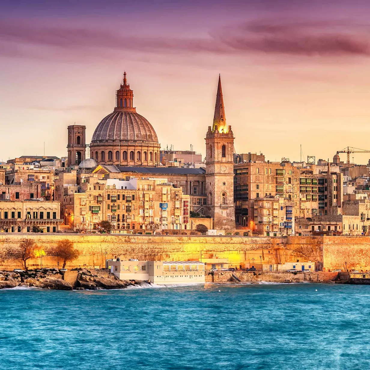 Sea view of Malta with historic buildings in background