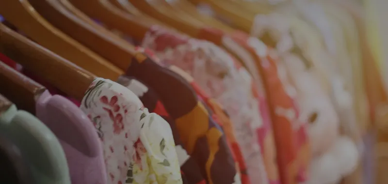 Colourful clothes on rail