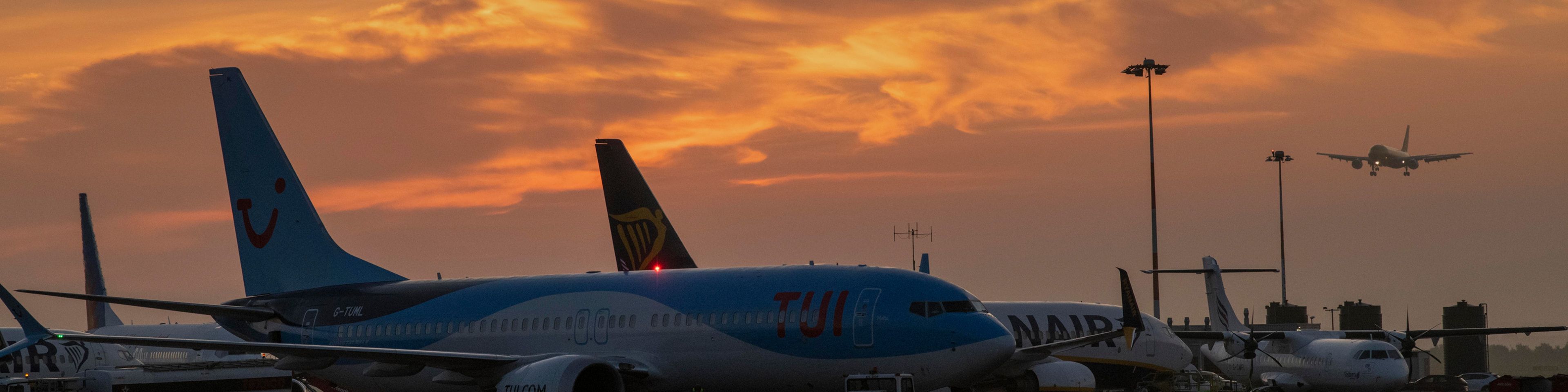 Planes parked up with sunset in background