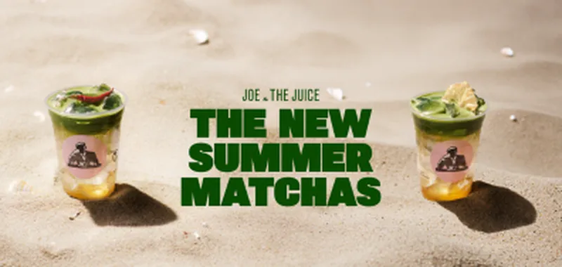 Two cups of green matcha drinks with lemon slices on sand, featuring "Joe & The Juice" and "The New Summer Matchas" text in bold green.