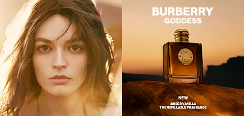 A woman's face softly lit on the left; on the right, a Burberry Goddess perfume bottle with an amber sunset background.