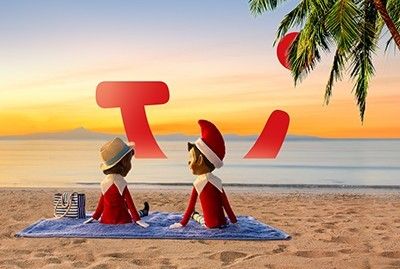 Two elves sitting on beach