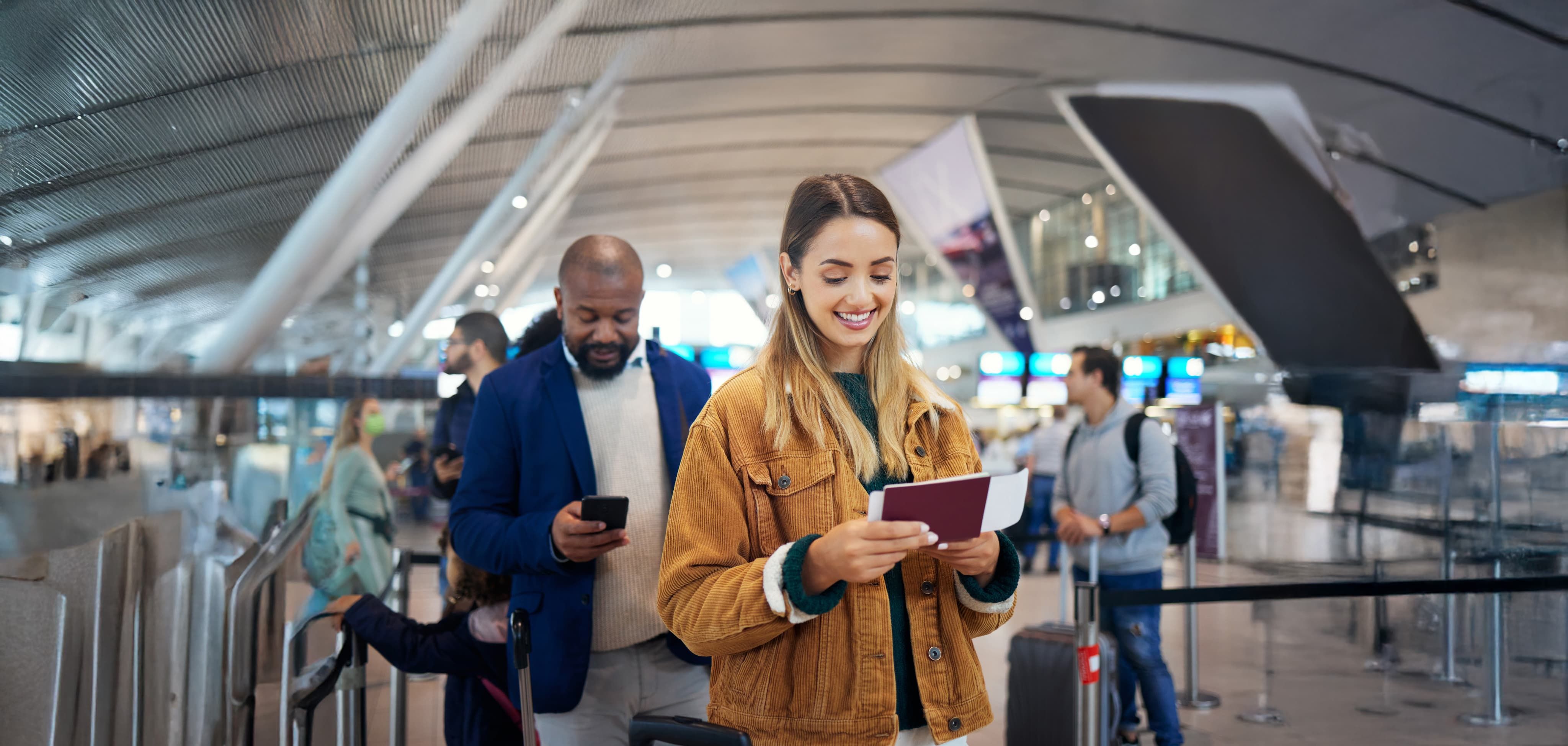 Passengers smiling whilst in queue