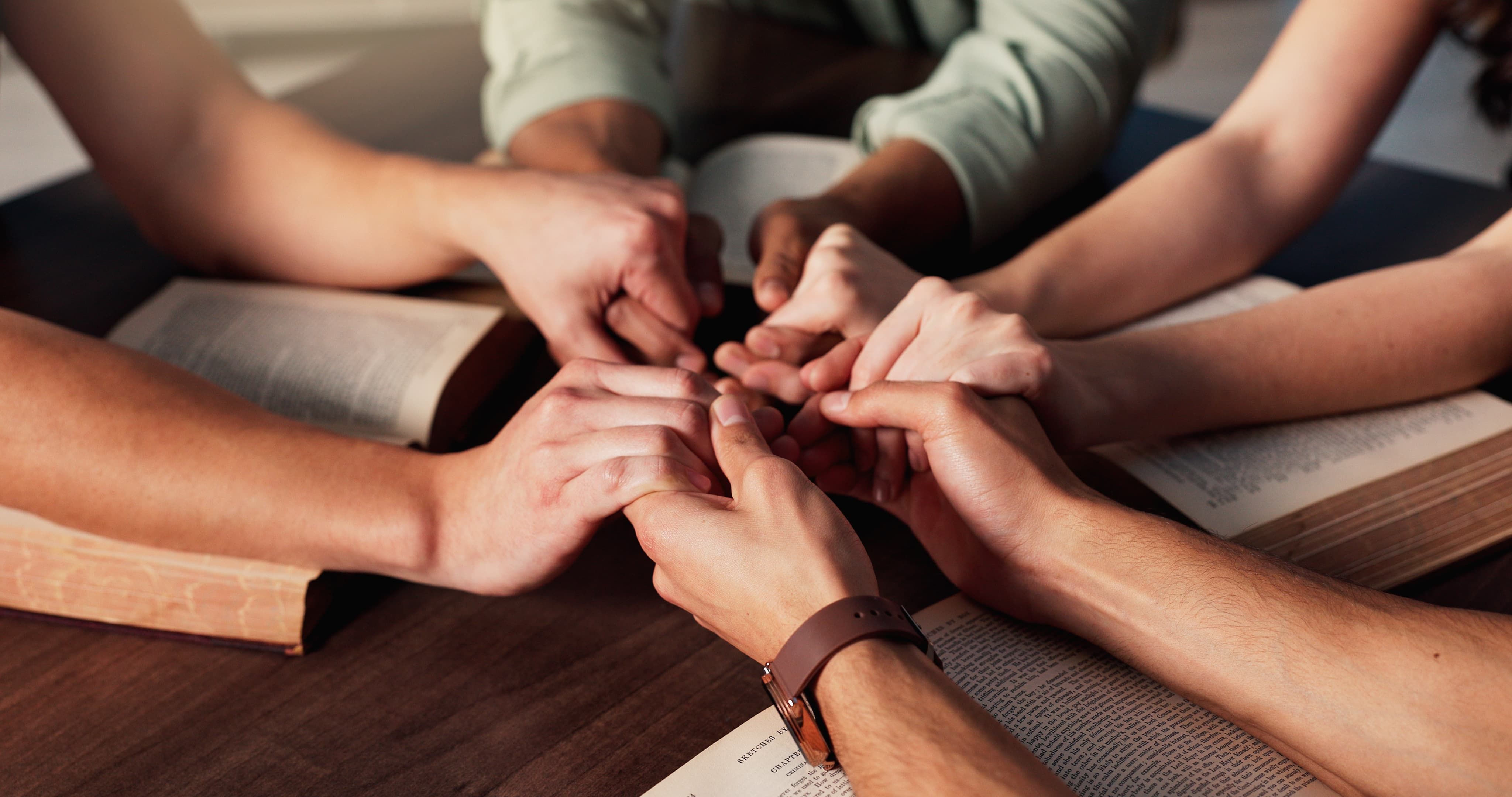 Group of people holding hands