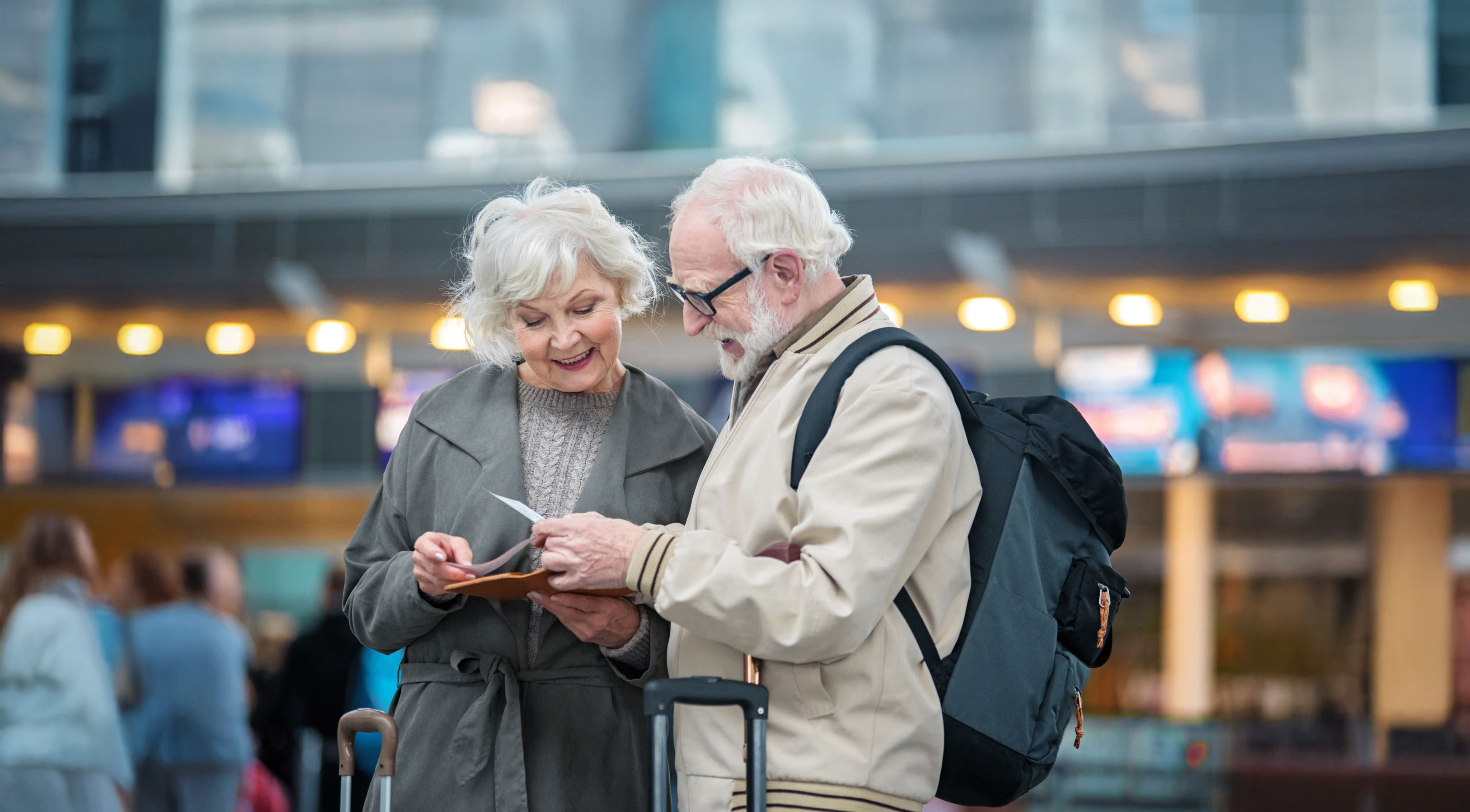 A couple looking at tickets