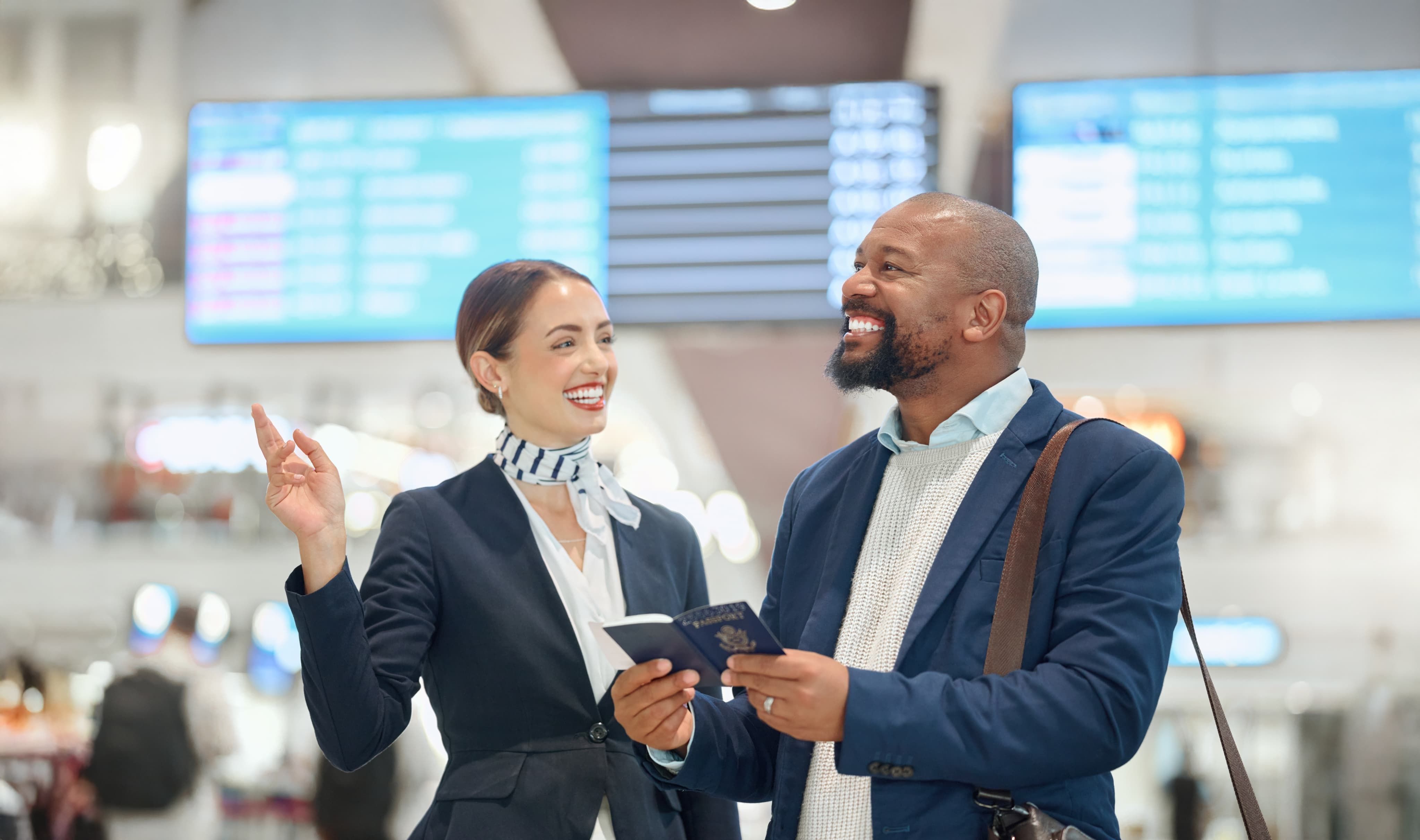 Woman that works at airport helping passenger
