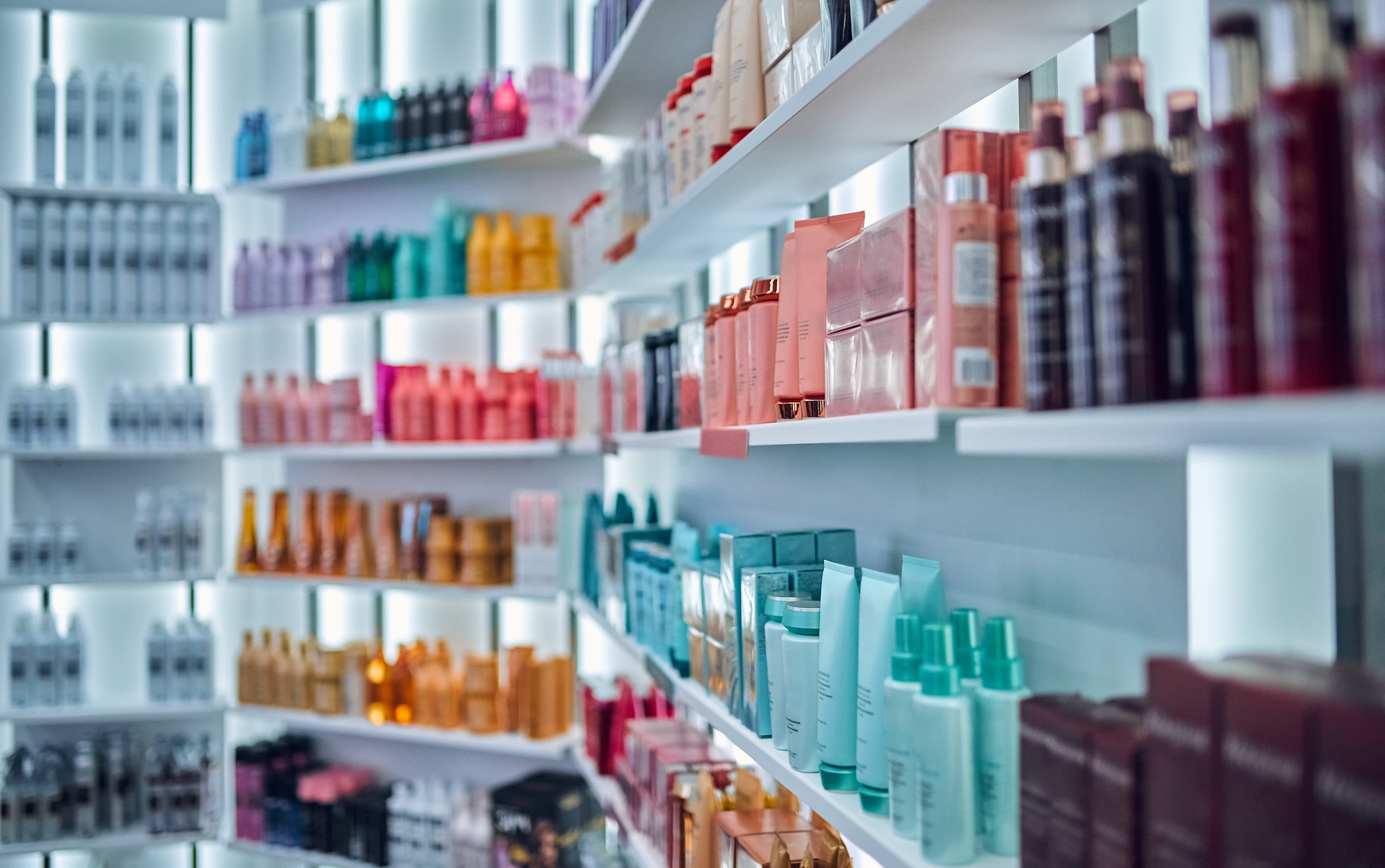 Beauty products stacked on shelf in shop