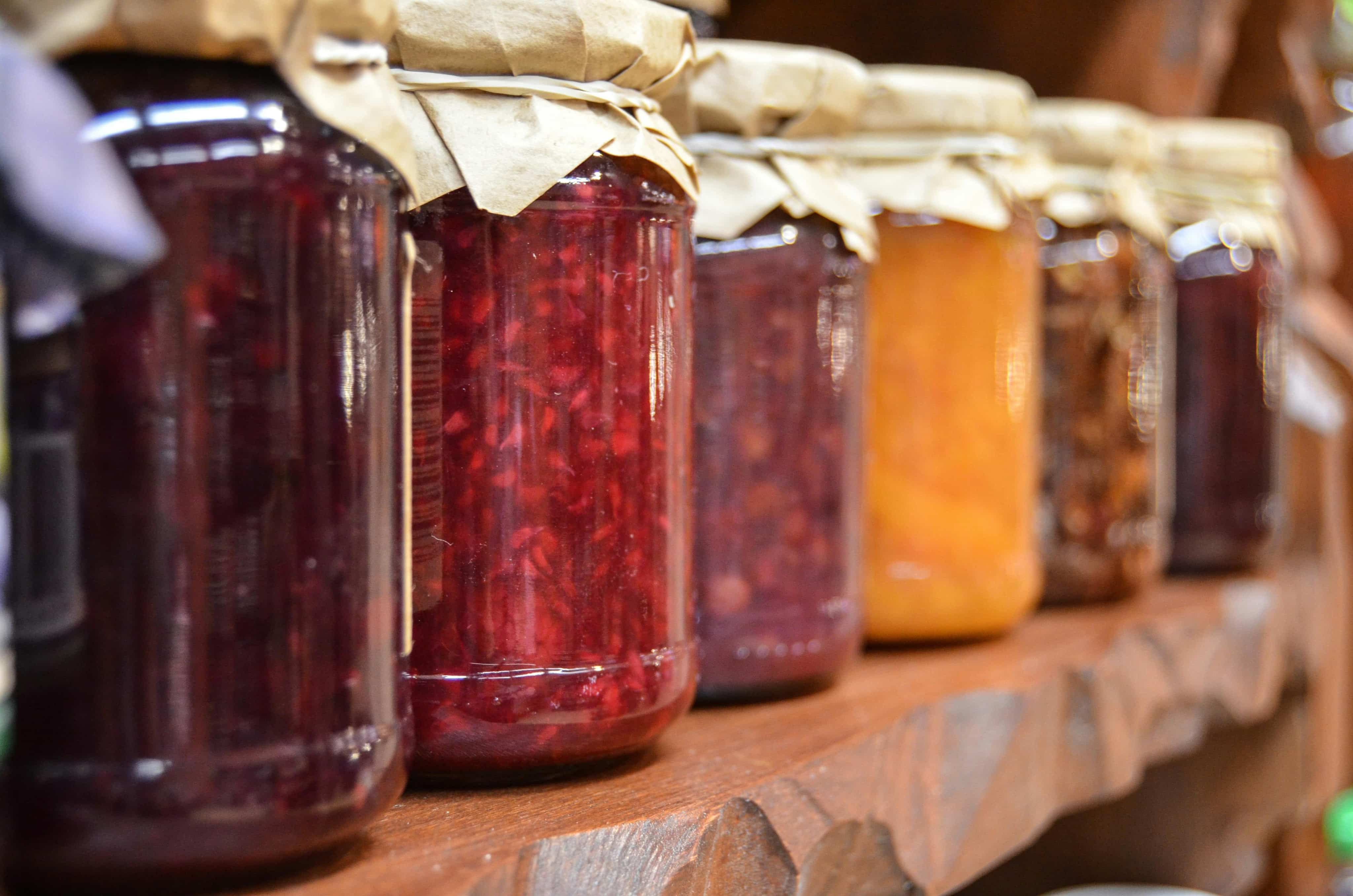 Different coloured jams in jars